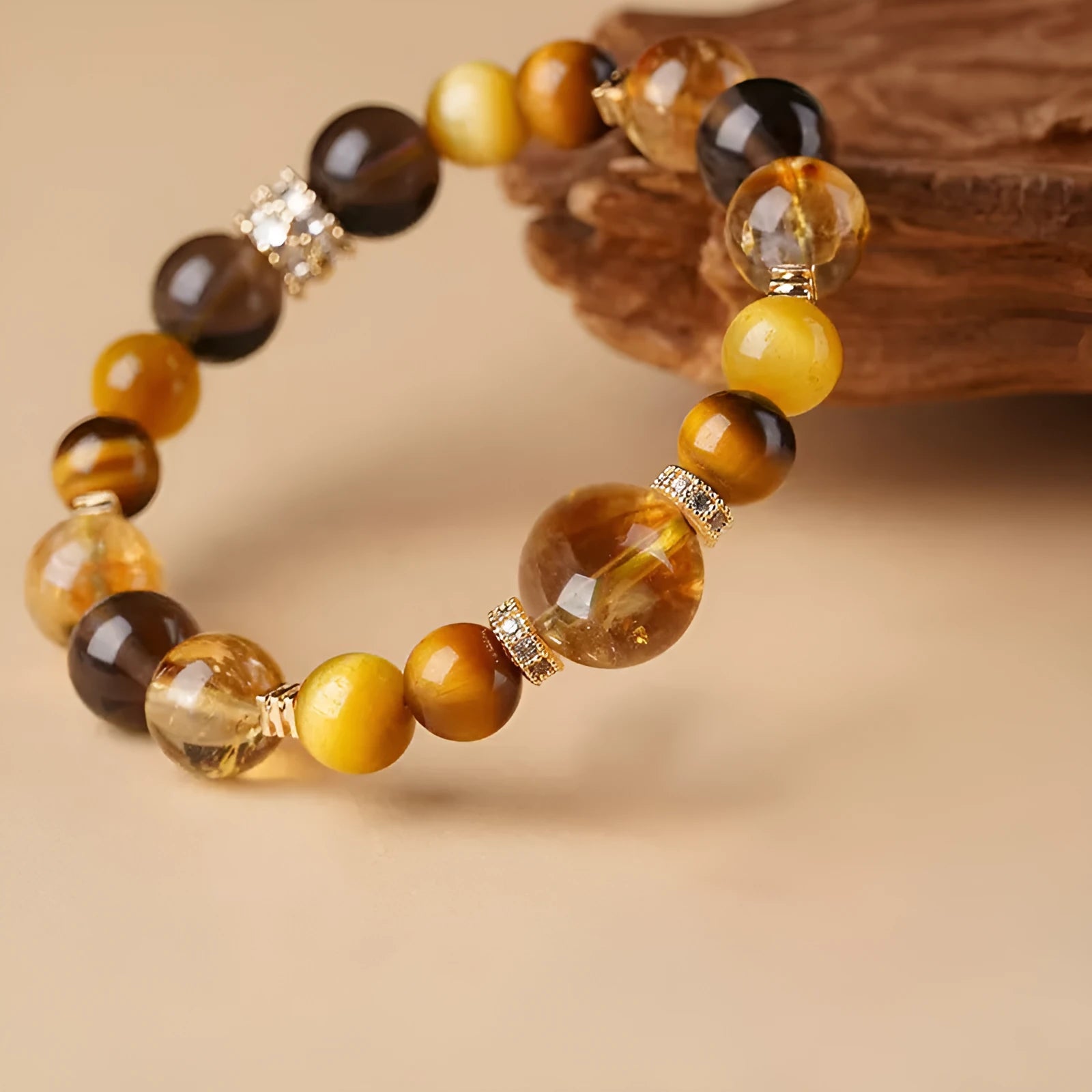 Natural yellow tiger-eye crystal bracelet in geometric tower design showing 10mm and 12mm size options