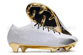 Men's low-top football shoes with knitted upper, lace-up front, and rubber sole with FG studs.