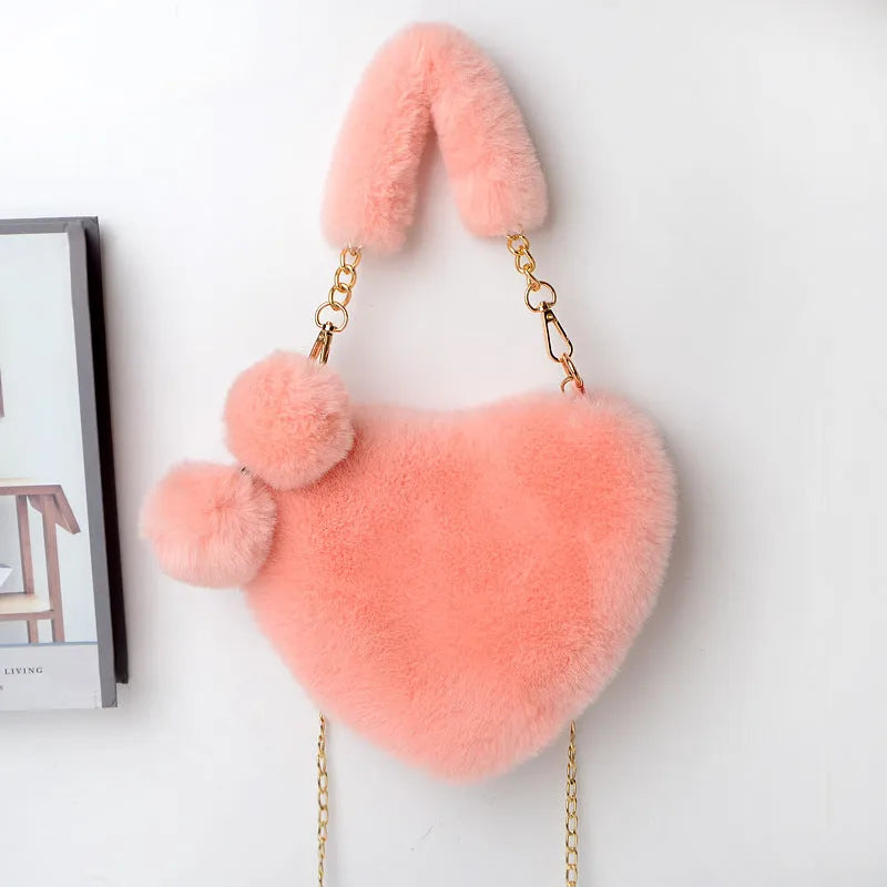 Heart-shaped women's plush handbag with soft texture and detachable shoulder strap in medium size