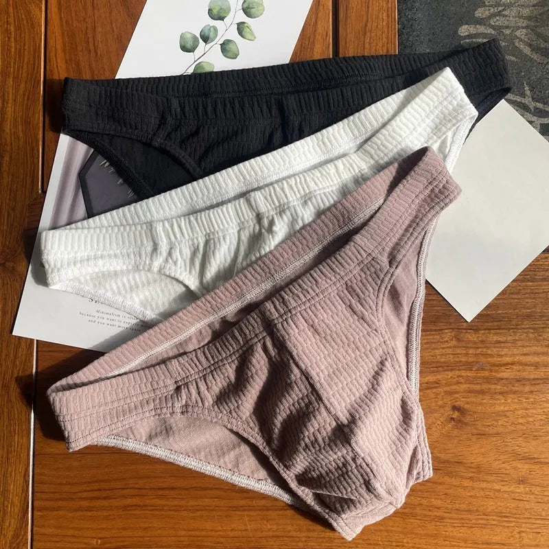 Men's cotton briefs in solid colours showing mid waist and triangle design