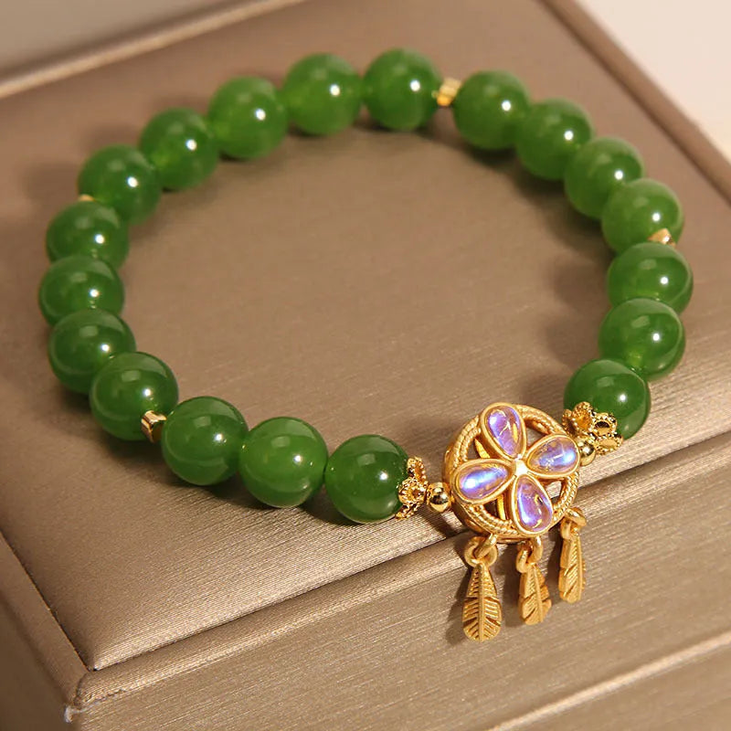 Green jasper bracelet for women with a crystal four-leaf clover dream catcher pendant.