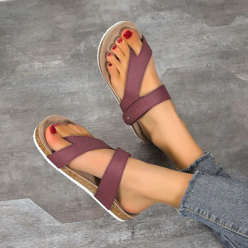 Women's flat toe ring flip-flop in a solid colour with a thick foam sole.