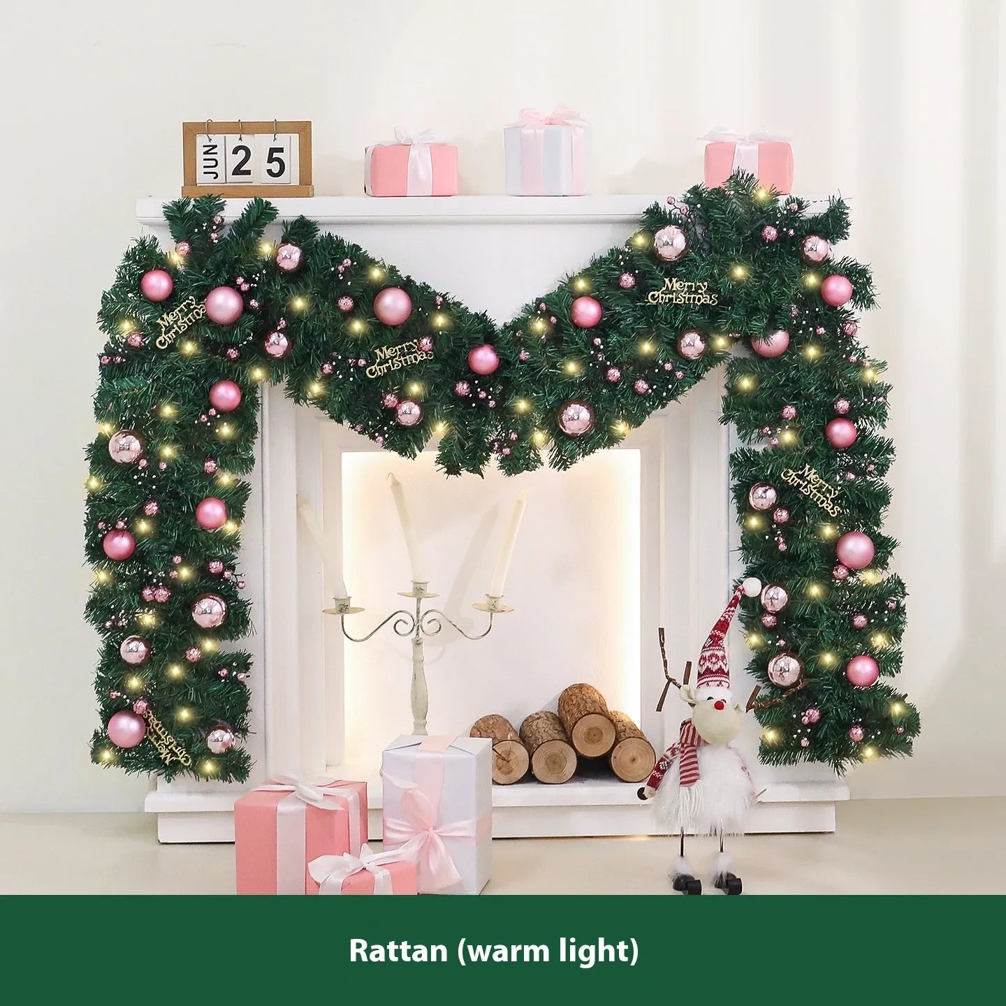 Pink Christmas rattan garland with small fruit details and LED lights draped across doorway
