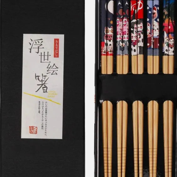 Set of five pairs of bamboo chopsticks with colourful Japanese lucky cat pattern design.