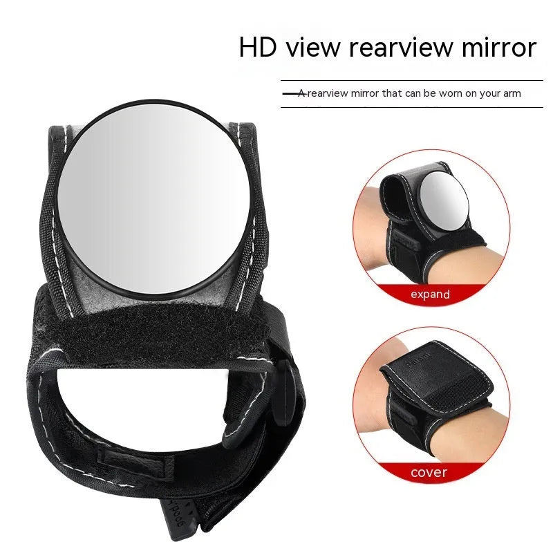 Black nylon wrist-mounted rear-view mirror for bicycles on a cyclist's wrist.