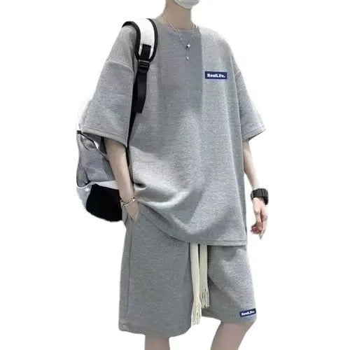 A waffle-textured leisure sports suit consisting of a short-sleeve top and shorts, shown in blue.