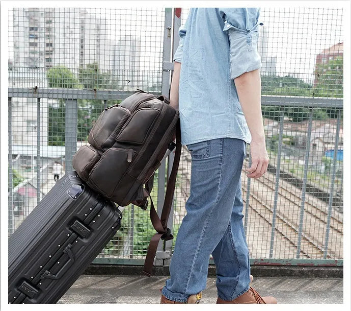 Dark brown genuine cowhide leather backpack with 17-inch laptop compartment and multiple internal organisers