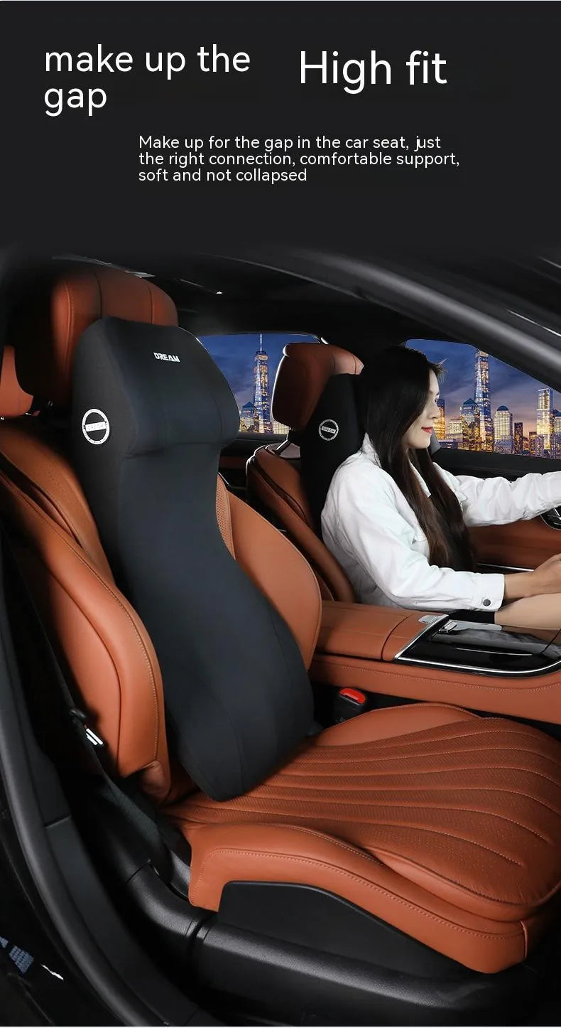 Black automotive memory foam cushion and lumbar support pillow on a car seat.