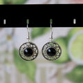 Miao silver earrings with turquoise geometric flower disk and totem patterns