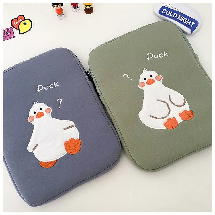 Blue cotton tablet case with embroidered cartoon duck design and zipper closure