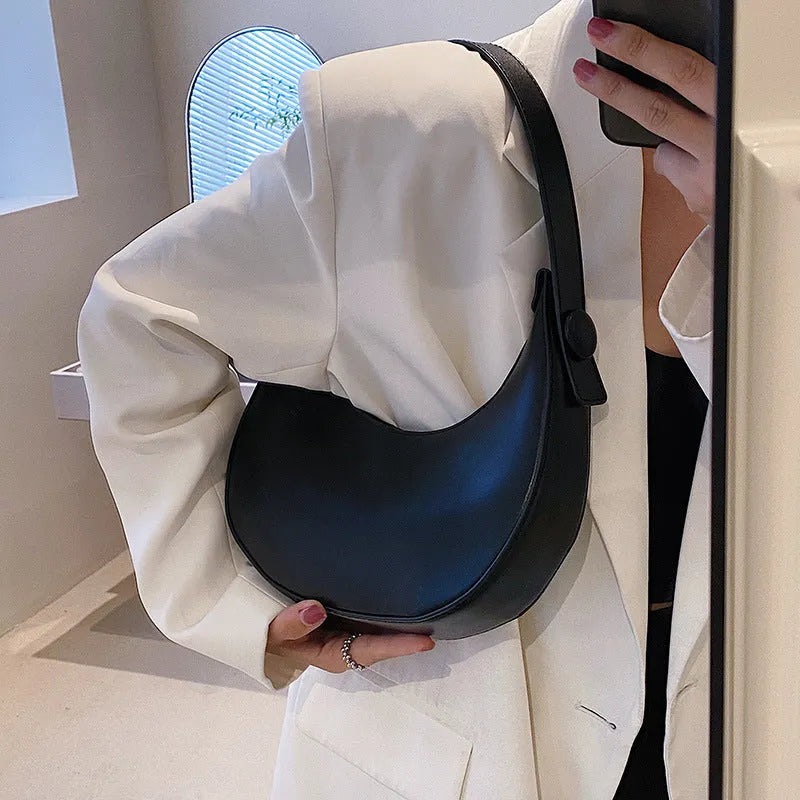 Women's cream yellow retro dumpling-shaped PU leather shoulder bag showing front and internal zippered pocket.