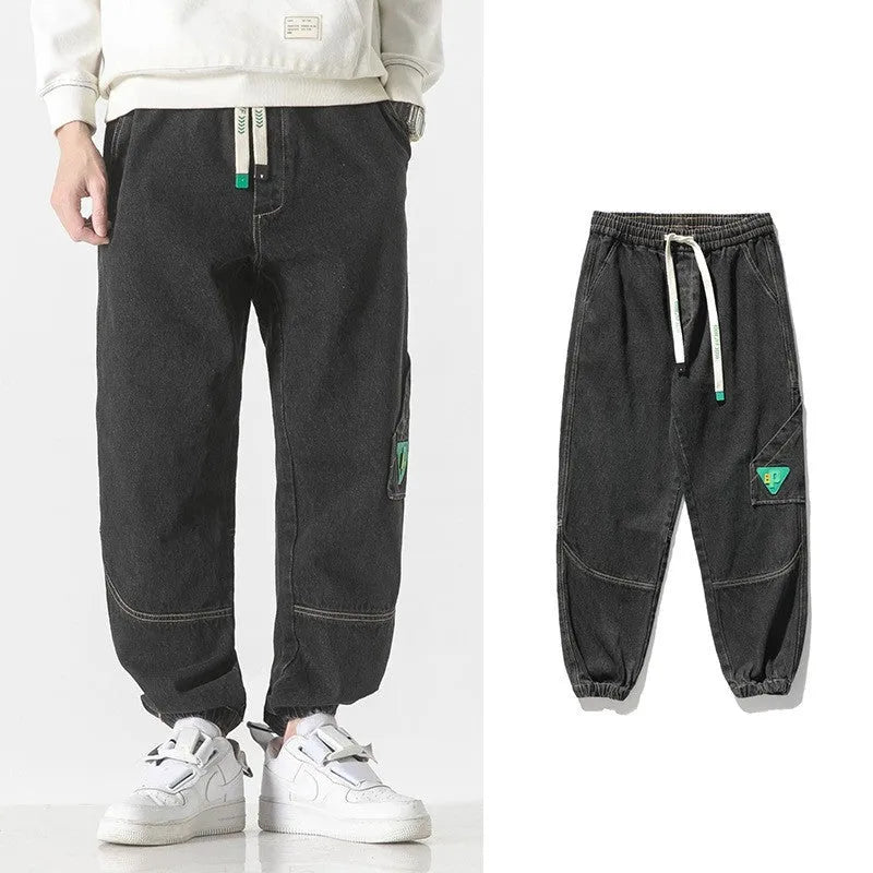 Men's loose-fit tapered cotton trousers in black, blue and grey colours showing mid-waist design