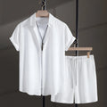 Men's black cotton blend short sleeve shirt and matching shorts set displayed together