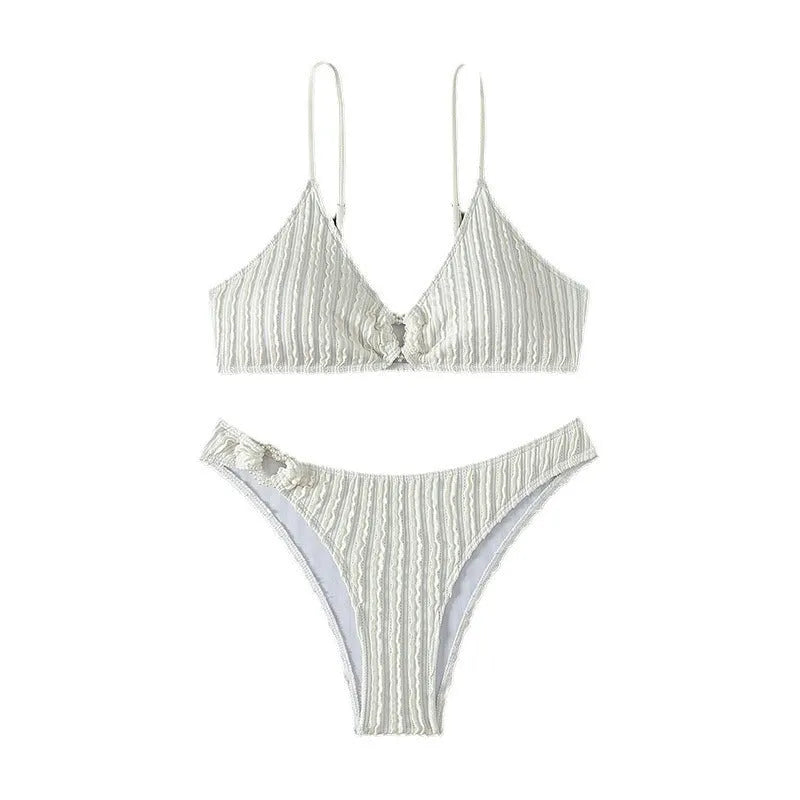 White women's V-neck swimsuit set with matching shorts for beach swimming