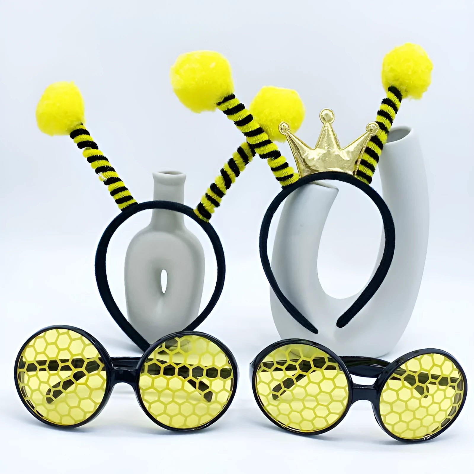 Yellow children's costume headband and glasses set with bee, butterfly, and ladybug patterns.