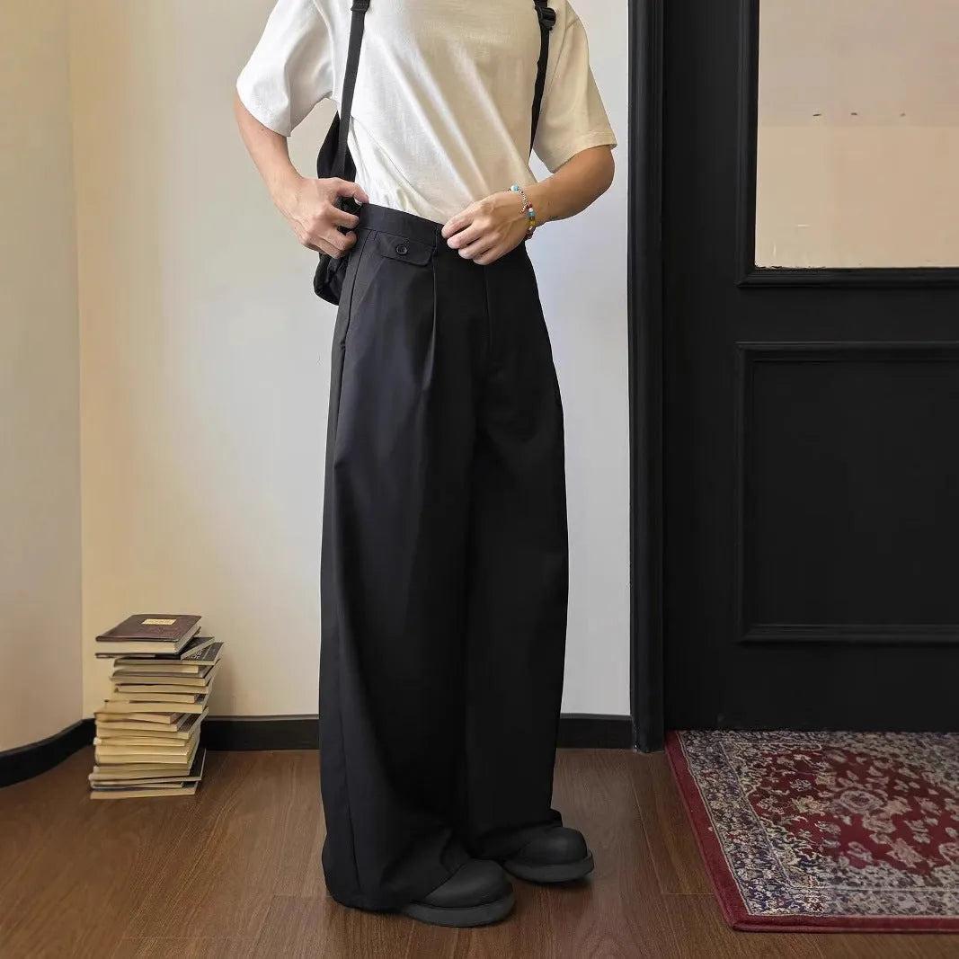 Man wearing straight-leg loose fit casual trousers in brown, showcasing the drape and fit.