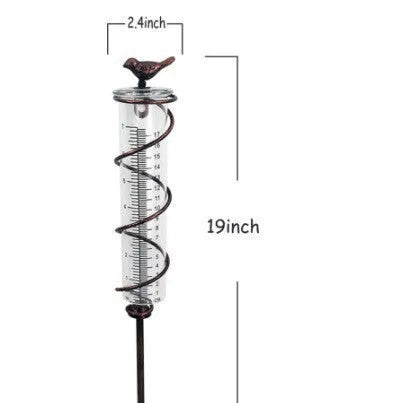 Cast iron and glass outdoor rain gauge with bird design and measurement scale for garden rainfall monitoring