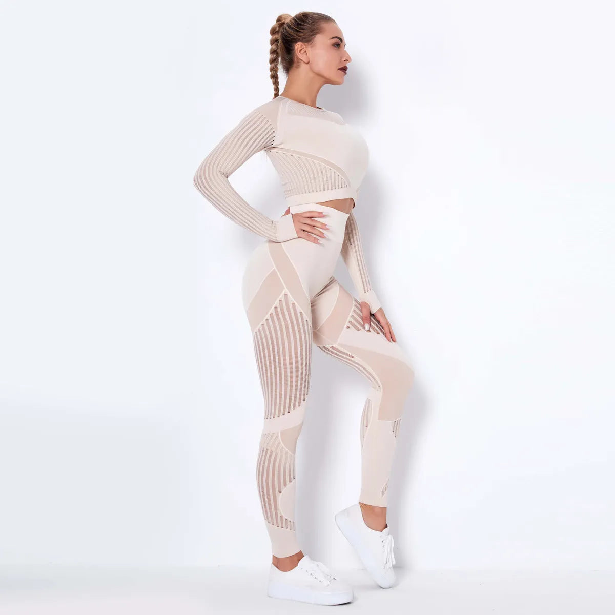 Women's black seamless knitted long-sleeved yoga wearsuit with stripe pattern, shown in a yoga pose.