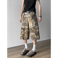 Yellow women's jeans with snake camouflage pattern and cropped length