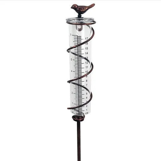 Cast iron and glass outdoor rain gauge with bird design and measurement scale for garden rainfall monitoring