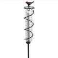 Cast iron and glass outdoor rain gauge with bird design and measurement scale for garden rainfall monitoring