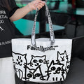 A colour printed portable PP woven handbag for storing clothing and cosmetics.