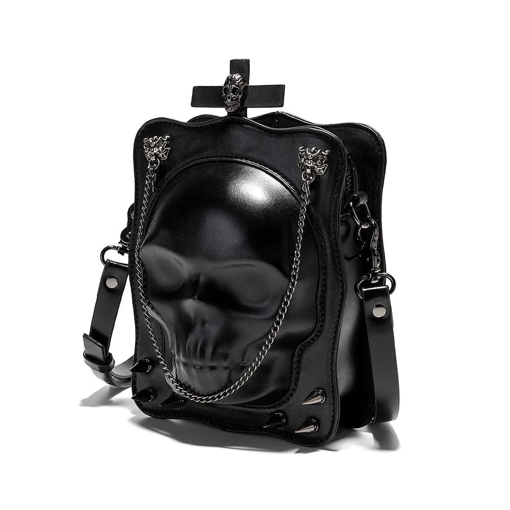 Black Gothic skull crossbody bag with square shape, chain detail, and zipper opening