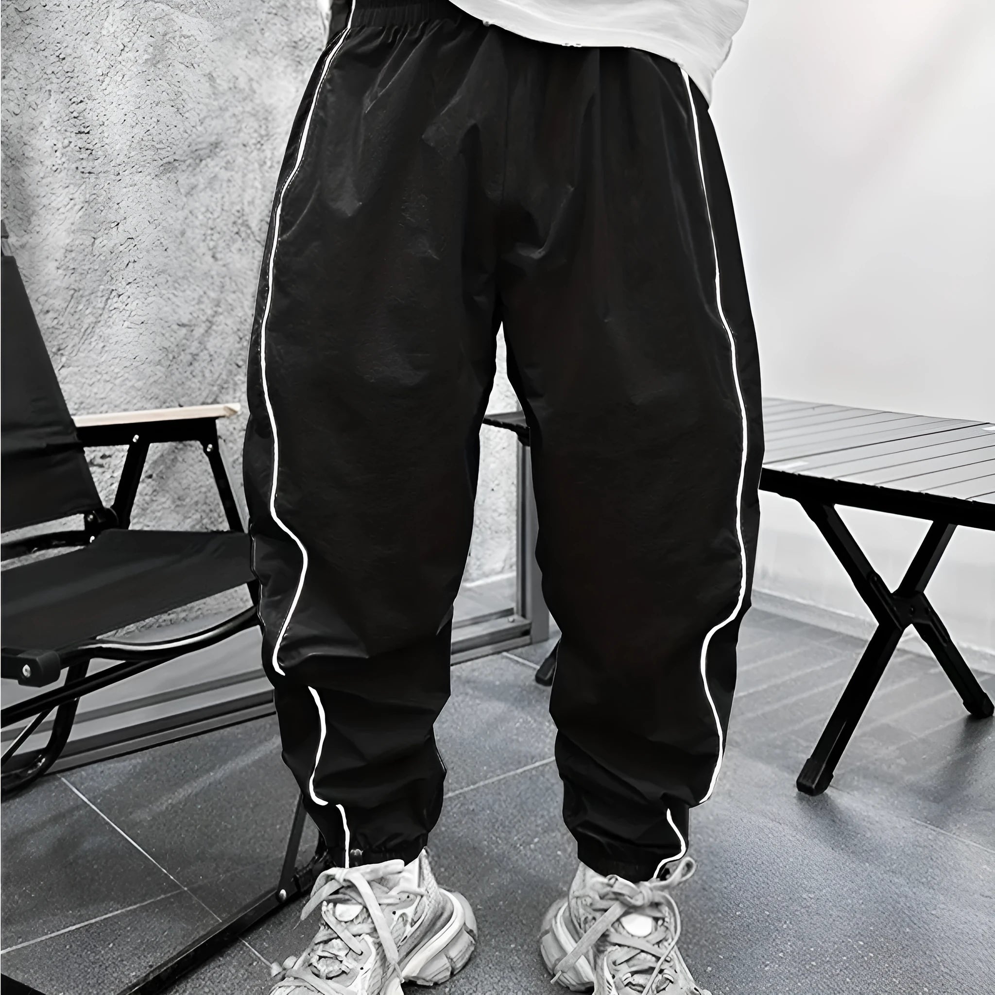 Men's loose blue bamboo fibre cropped sports trousers on a grey background