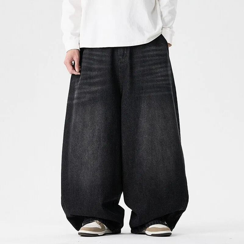 Men's plus-size light blue baggy jeans with a straight leg and zip fly