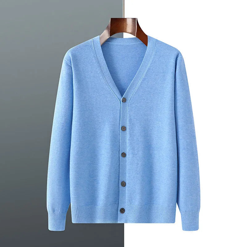 Man wearing a loose V-neck cardigan coat in Andy Velvet fabric, showing the long sleeves and available colour options.