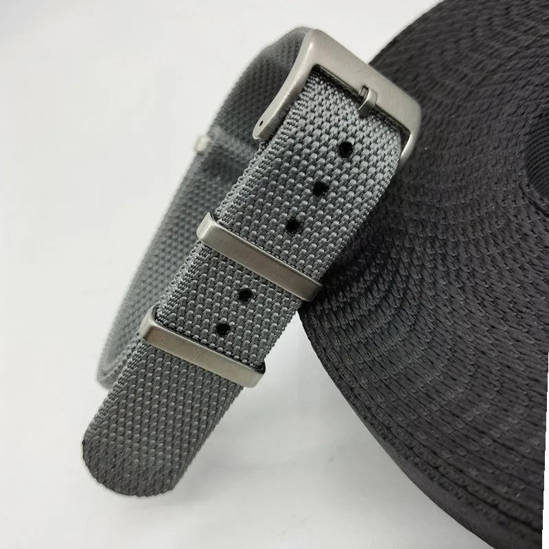 Nylon integrated watch strap in military colours showing 20mm and 22mm width options