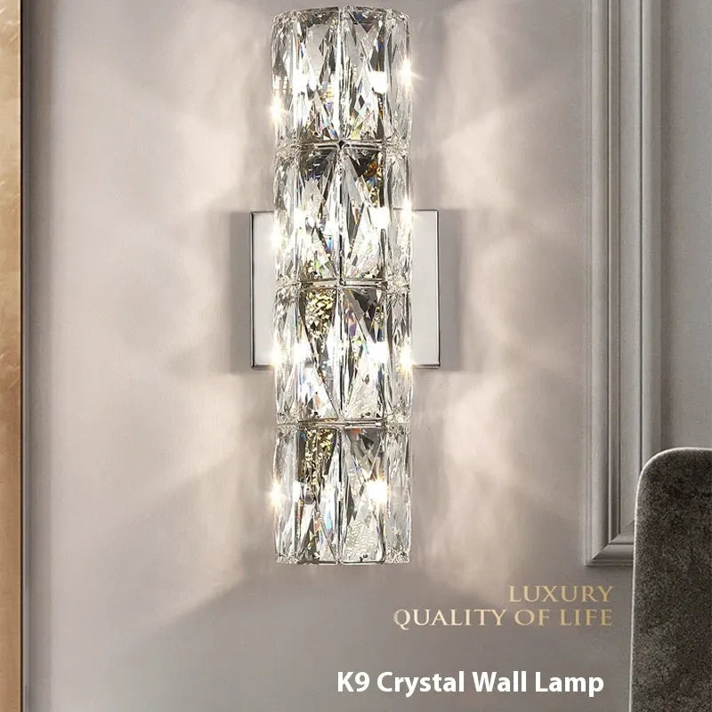 Modern crystal and stainless steel wall lamp in chrome finish with LED lighting.