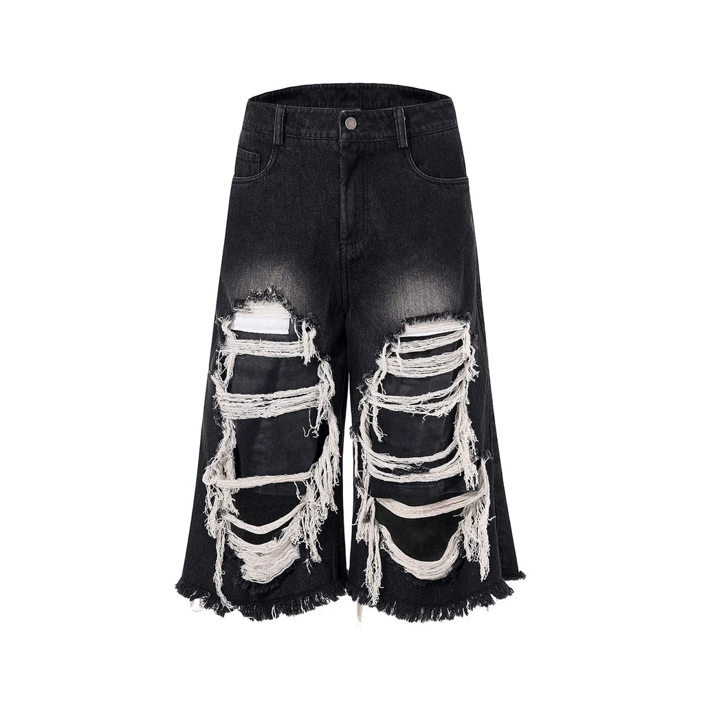Black women's cropped wide leg jeans with mid-high waist and ripped patch detail