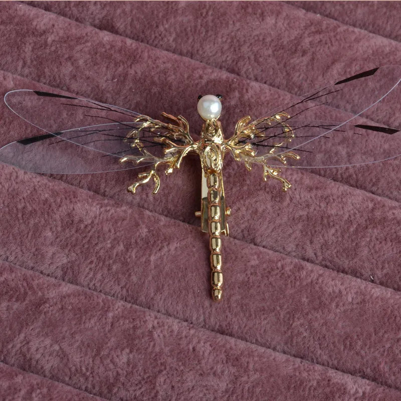 Golden electroplated dragonfly side clip headdress for women with detailed insect design
