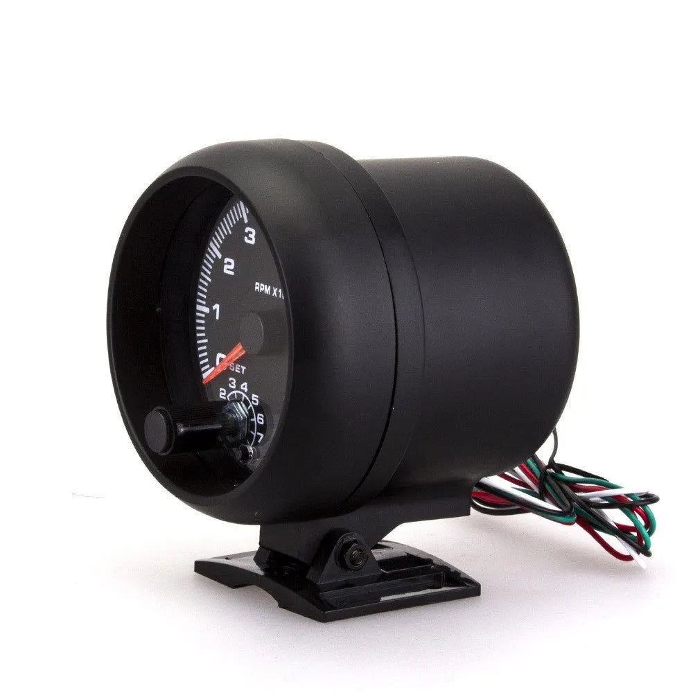 Black plastic universal automotive tachometer with blue light pointer and RPM scale.