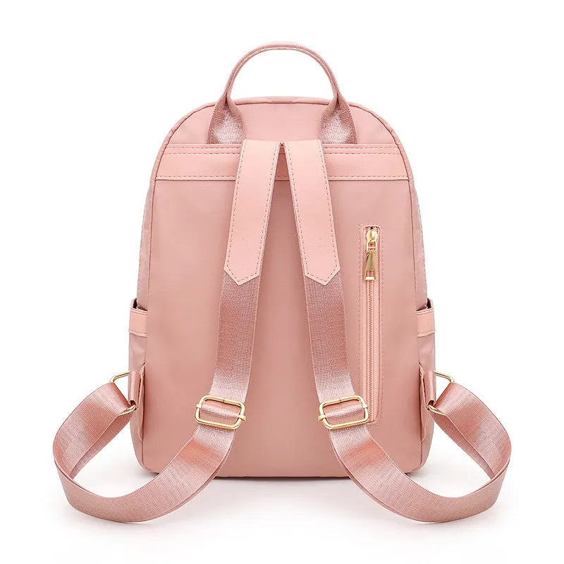 Soft nylon casual backpack in black or pink with three-dimensional pockets and double shoulder straps