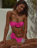 Striped bikini swimsuit with three-dimensional flower detail and split design, includes tube top and shorts.