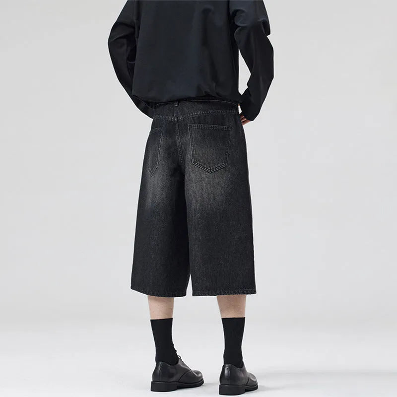 Men's loose straight-leg denim shorts in light blue on a model for summer