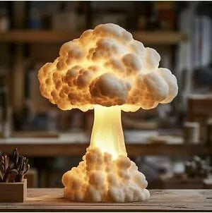 Modern art mushroom cloud table lamp with USB power cable on a desk.