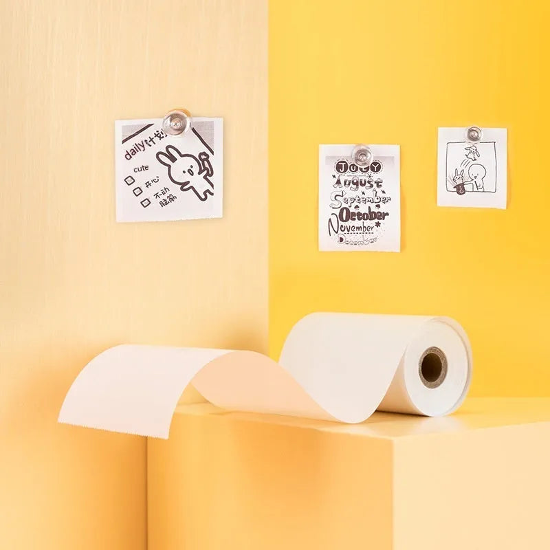 Box containing three rolls of white 57mm wide thermal paper for small printers.
