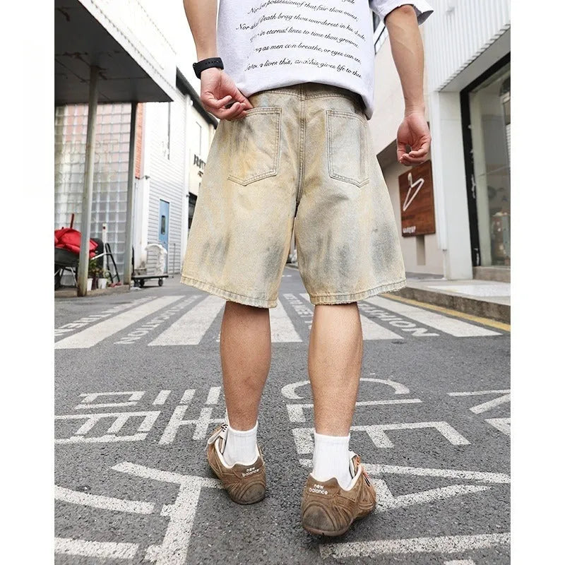 Light blue men's denim shorts with ripped detailing and a straight-leg cut