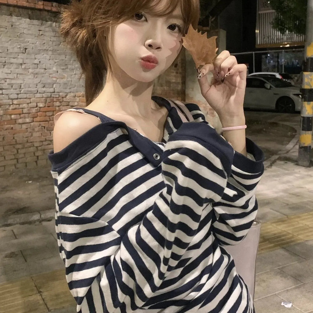 Dark blue oversized women's T-shirt with embroidery, buttons, and striped details in Korean style