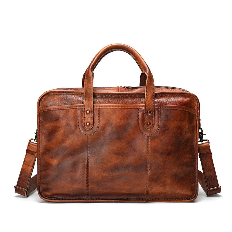 Large vintage leather men's briefcase with internal computer and camera pockets measuring 42cm wide