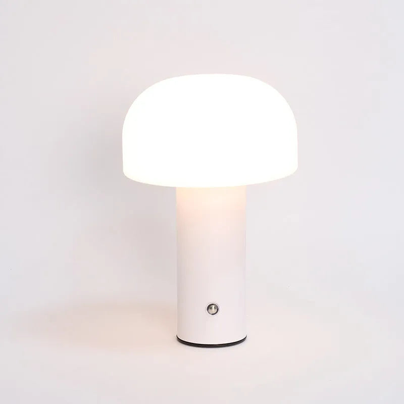 USB dual-purpose table lamp in black, green, orange or white with plug-in and charging functionality