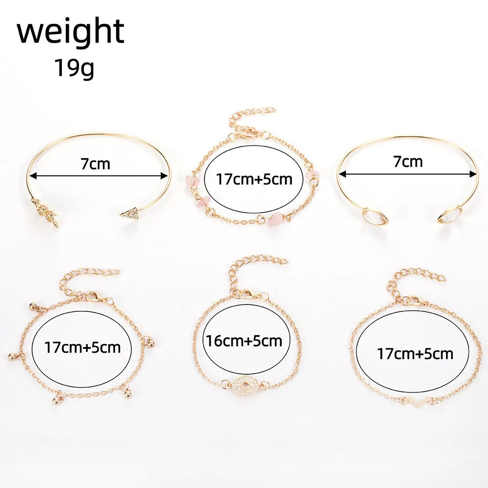 Golden bracelet charm set with six pieces including V-shape, arrow, water drop and drill spot designs