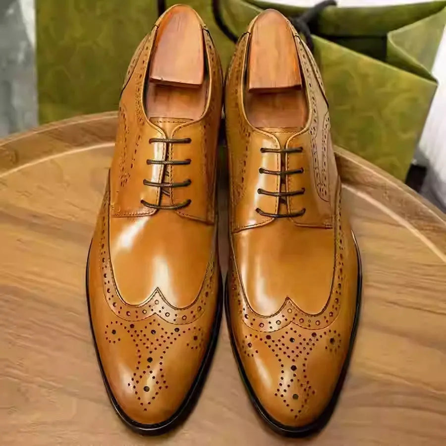 Men's burgundy British Brock pointed toe formal leather shoes on a white background.