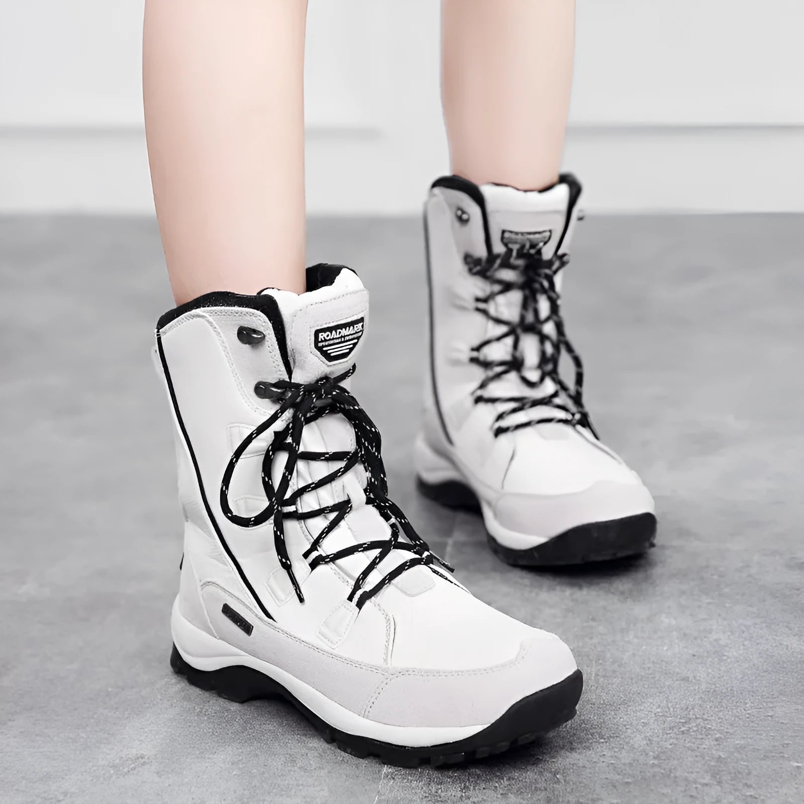 Women's mid-calf thermal snow boots in genuine leather with round toe and rubber sole