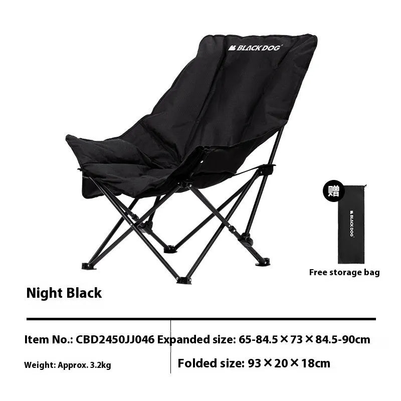 Night Black portable folding moon chair in use outdoors, showing its reclined design and carry handle.