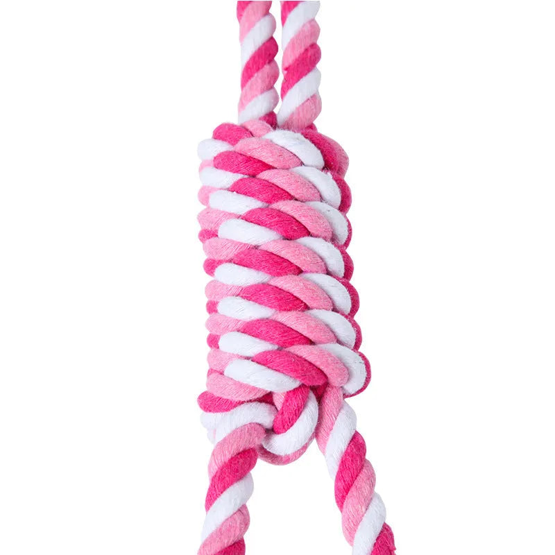 Red and white cotton string dog tug toy, approximately 38 cm long, for medium and large breeds.