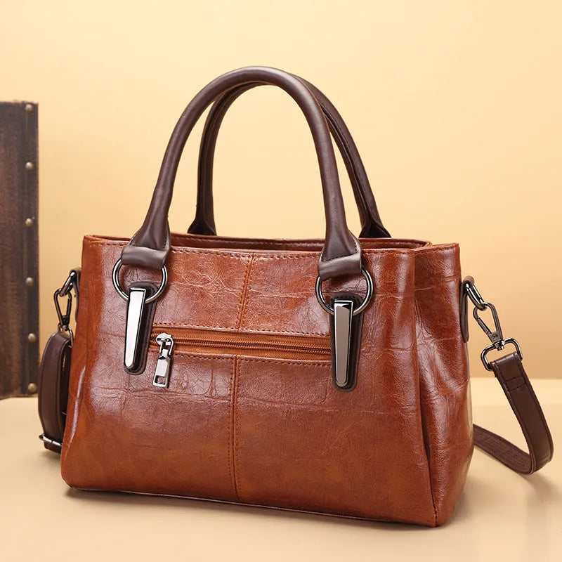 Horizontal square PU leather shoulder bag with single strap showing internal organiser compartments